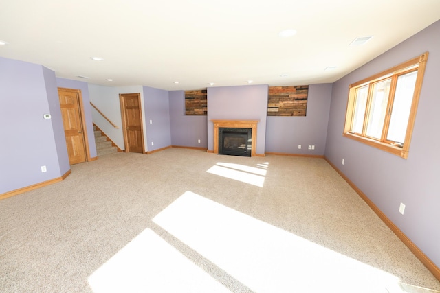 unfurnished living room with carpet floors