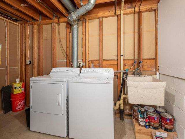 laundry area featuring sink and washer and dryer