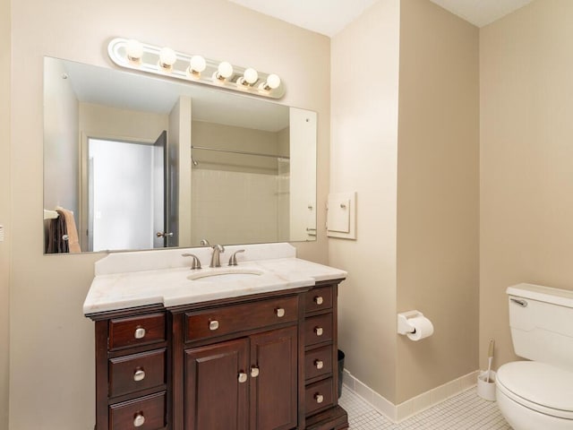 bathroom with tile patterned flooring, toilet, vanity, and walk in shower