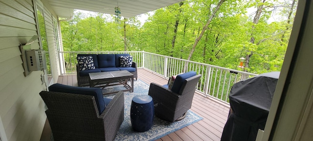 14453 County Highway 5, Lake Park, MN 56554 - deck with an outdoor living space, a forest view, and a grill