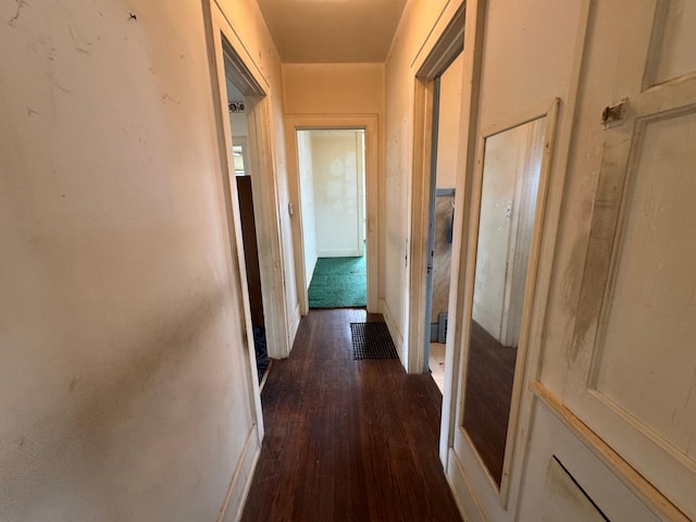 hallway featuring dark wood-style flooring