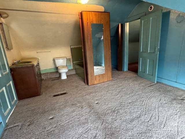 bathroom with visible vents, a sink, and toilet