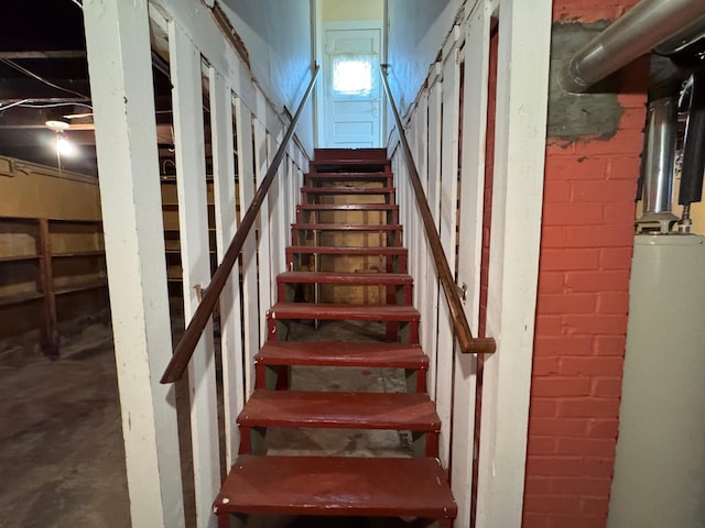 stairway featuring gas water heater