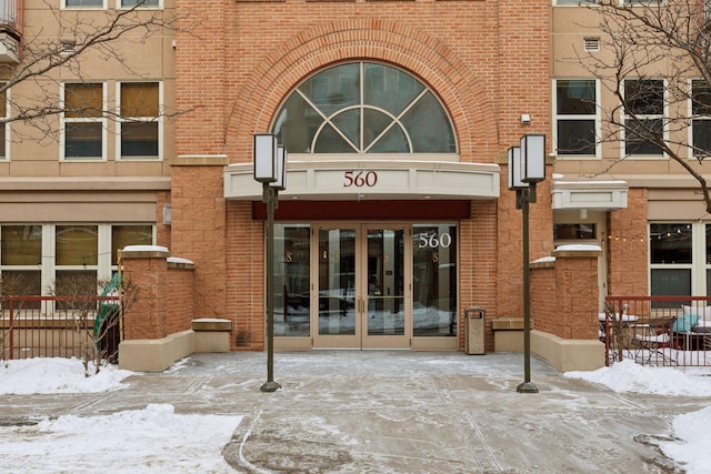 view of snow covered property entrance