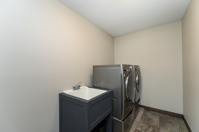 washroom featuring sink and independent washer and dryer