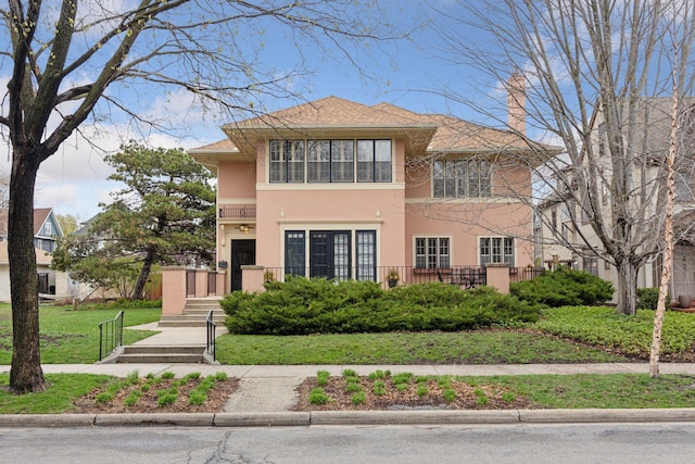 2225 Irving Ave S Unit 2, Minneapolis, MN 55405 - view of front facade featuring a front yard and stucco siding