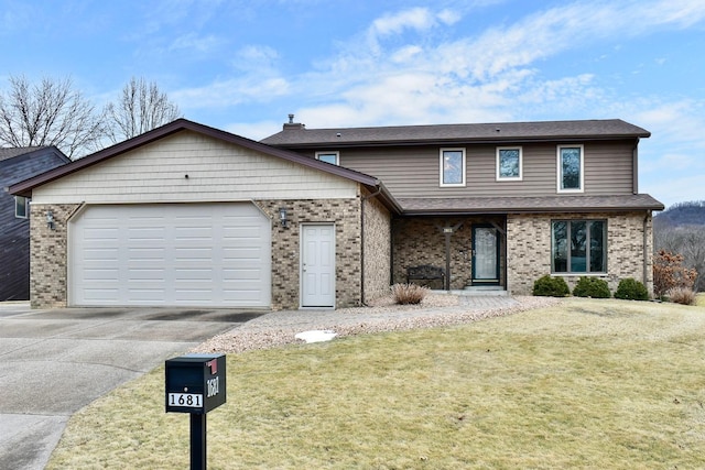 view of property featuring a garage and a front yard