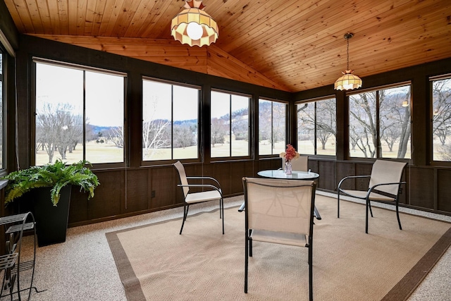 sunroom featuring plenty of natural light and vaulted ceiling