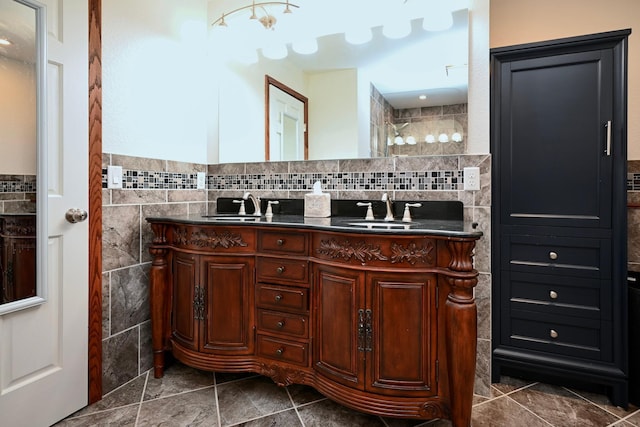 bathroom with vanity and tile walls