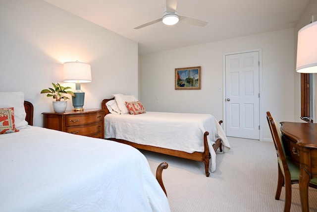 bedroom with ceiling fan and light colored carpet