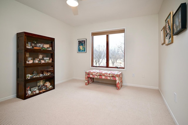 misc room featuring light carpet and ceiling fan