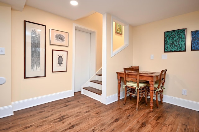 dining area with dark hardwood / wood-style flooring