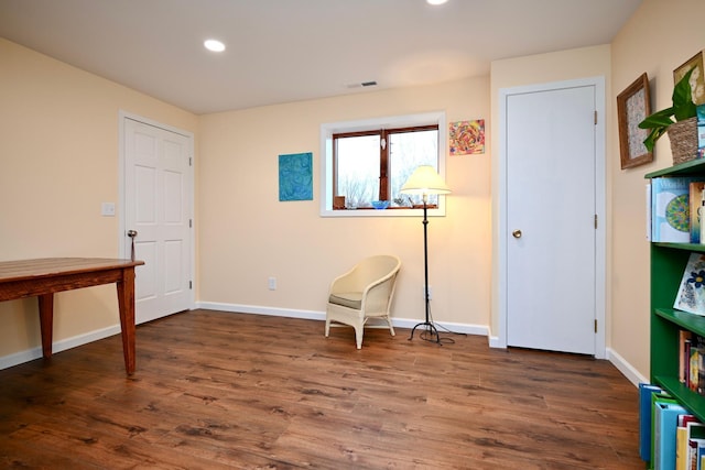 living area with dark hardwood / wood-style floors