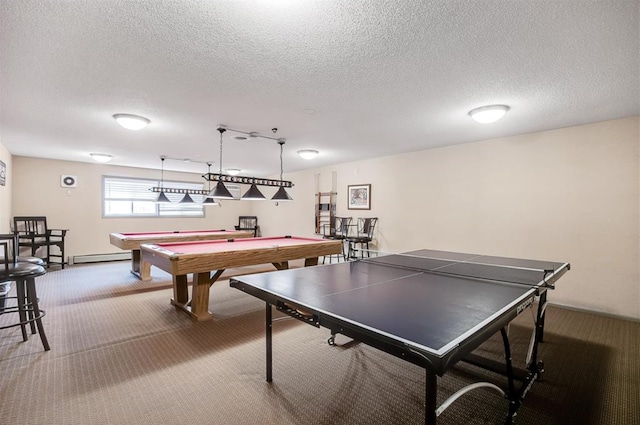 game room with a textured ceiling, baseboard heating, carpet flooring, and pool table