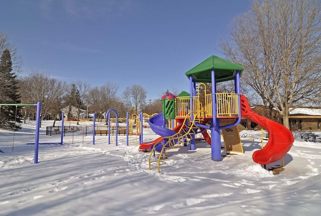 snow covered playground featuring playground community