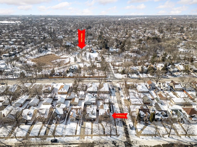 snowy aerial view featuring a residential view