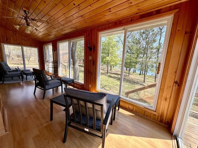 14788 Coyote Dr, Park Rapids, MN 56470 - sunroom with vaulted ceiling, wooden walls, wood finished floors, and wooden ceiling
