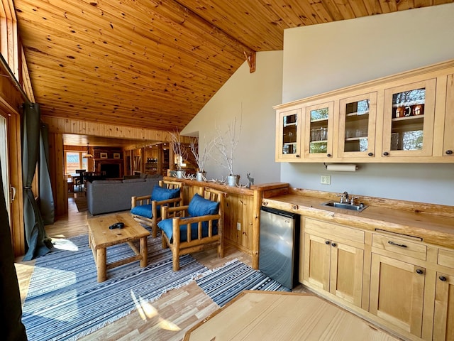 14788 Coyote Dr, Park Rapids, MN 56470 - bar with stainless steel fridge, light wood-style floors, a wood ceiling with exposed beams, and high vaulted ceiling