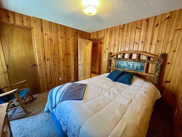 14788 Coyote Dr, Park Rapids, MN 56470 - bedroom featuring carpet floors, wood walls, and a textured ceiling