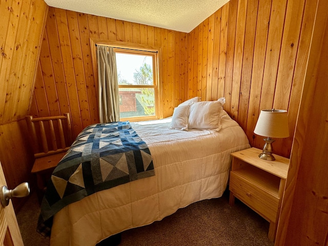 14788 Coyote Dr, Park Rapids, MN 56470 - bedroom with carpet floors, wood walls, and a textured ceiling
