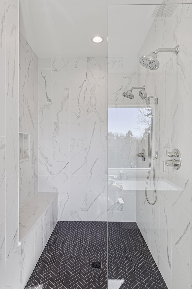 bathroom with a tile shower