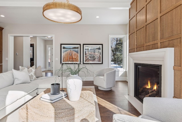 living room with dark hardwood / wood-style flooring