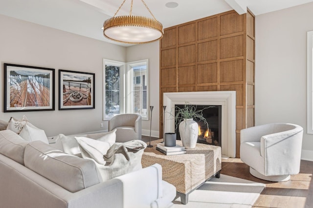 sitting room with hardwood / wood-style flooring