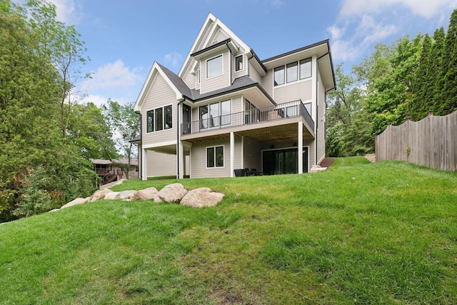 back of property featuring a yard