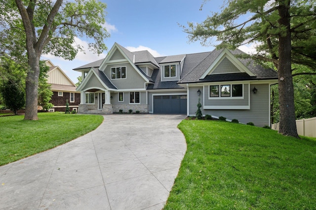 view of front of house featuring a garage and a front lawn