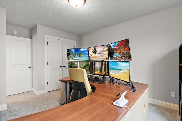 office area featuring light colored carpet and a textured ceiling