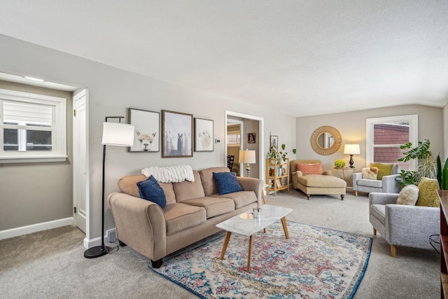 living room featuring carpet floors and baseboards