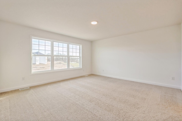 empty room with carpet flooring