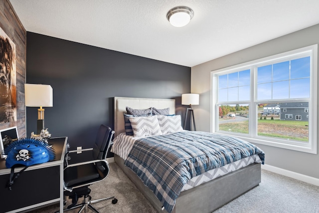 carpeted bedroom with a textured ceiling