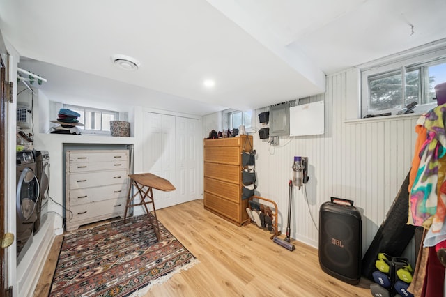 interior space featuring washer and dryer, a closet, and wood finished floors