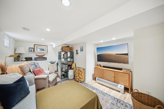 living room featuring wood finished floors and recessed lighting