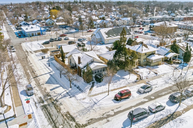 snowy aerial view featuring a residential view