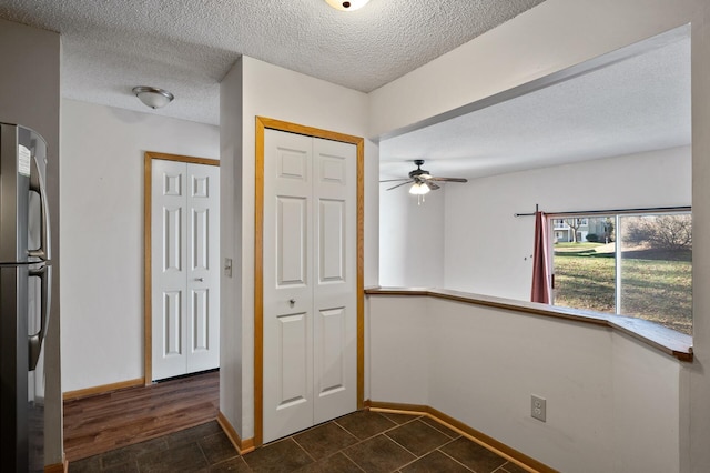 foyer entrance with a textured ceiling