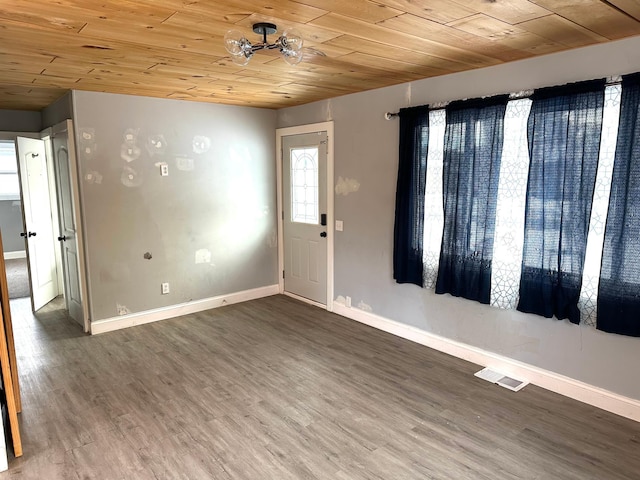 interior space with wood ceiling, ceiling fan, and hardwood / wood-style flooring