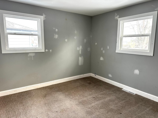 empty room with carpet flooring