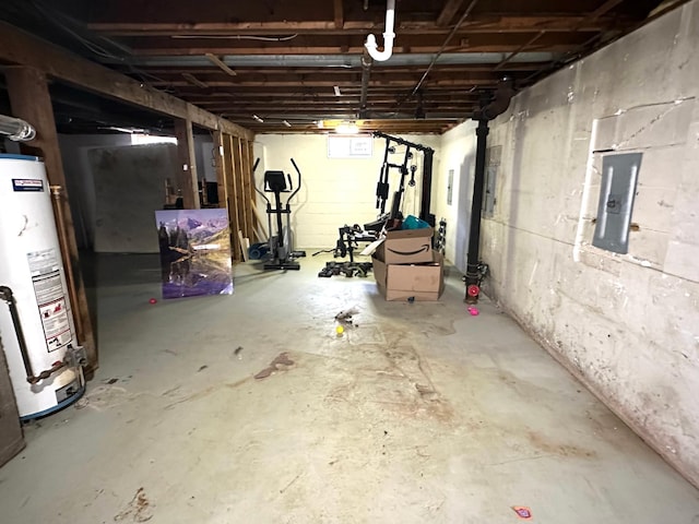 basement with electric panel and water heater