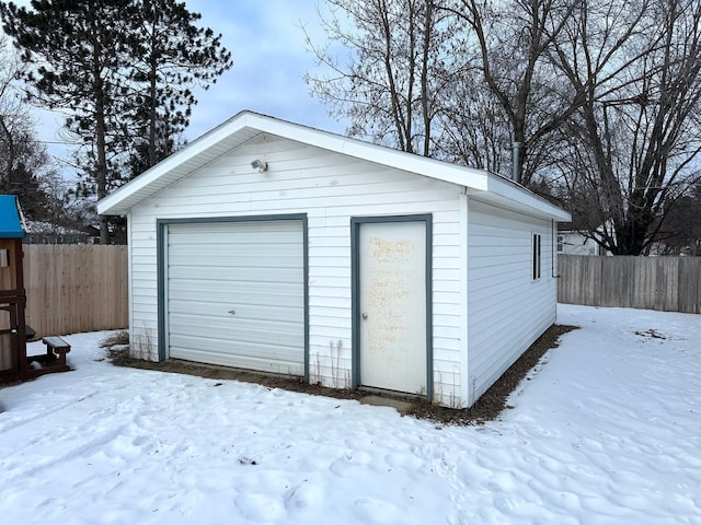 view of snow covered garage