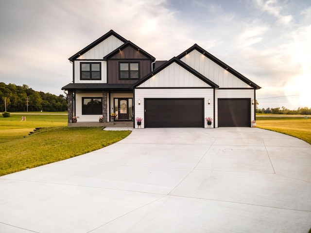 view of front of house with a garage and a front yard