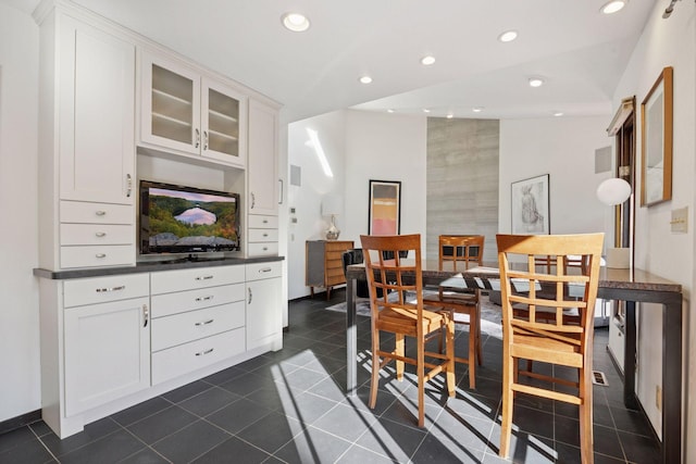 dining room with recessed lighting and dark tile patterned flooring