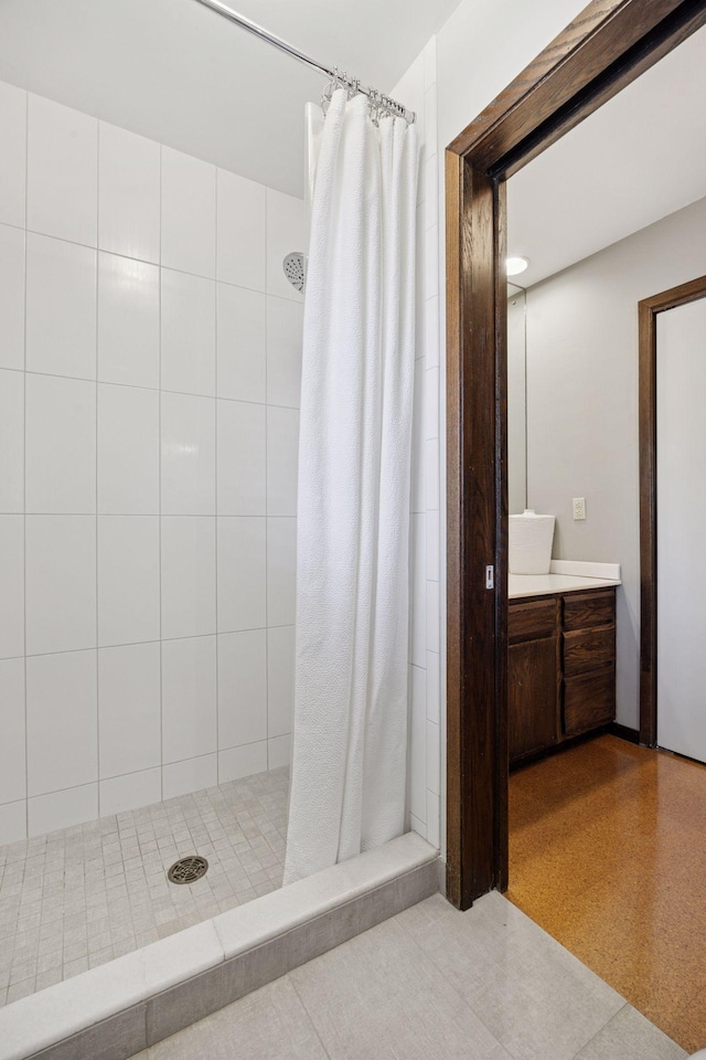 bathroom with vanity and a shower stall