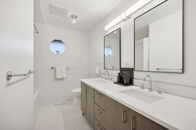 full bath featuring a sink, visible vents, and toilet