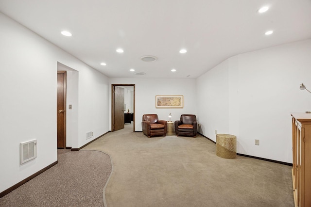 sitting room featuring recessed lighting, visible vents, and light colored carpet