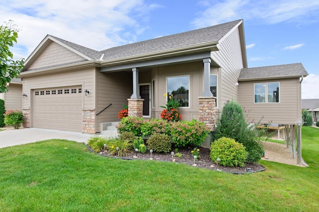 craftsman-style house featuring concrete driveway, stone siding, roof with shingles, an attached garage, and a front yard