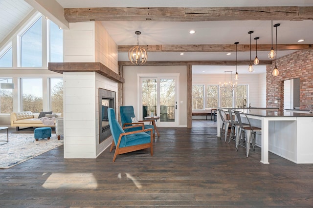 771 Zumbro Oaks Ln NW, Oronoco, MN 55960 - living area with dark wood-style flooring, beamed ceiling, and a notable chandelier