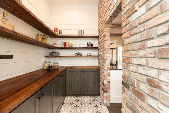 771 Zumbro Oaks Ln NW, Oronoco, MN 55960 - bar featuring a bar and light tile patterned floors