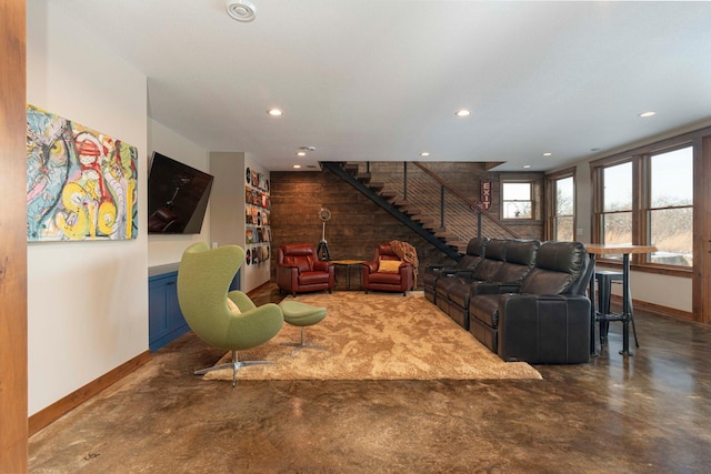 771 Zumbro Oaks Ln NW, Oronoco, MN 55960 - living area featuring finished concrete flooring, recessed lighting, baseboards, and stairway